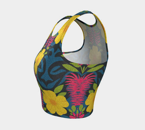 Honey Dazed Brand body-hugging racerback crop top featuring retro floral print with bright yellow flowers, pink geometric patterns, and blue swirls on dark background in performance knit fabric